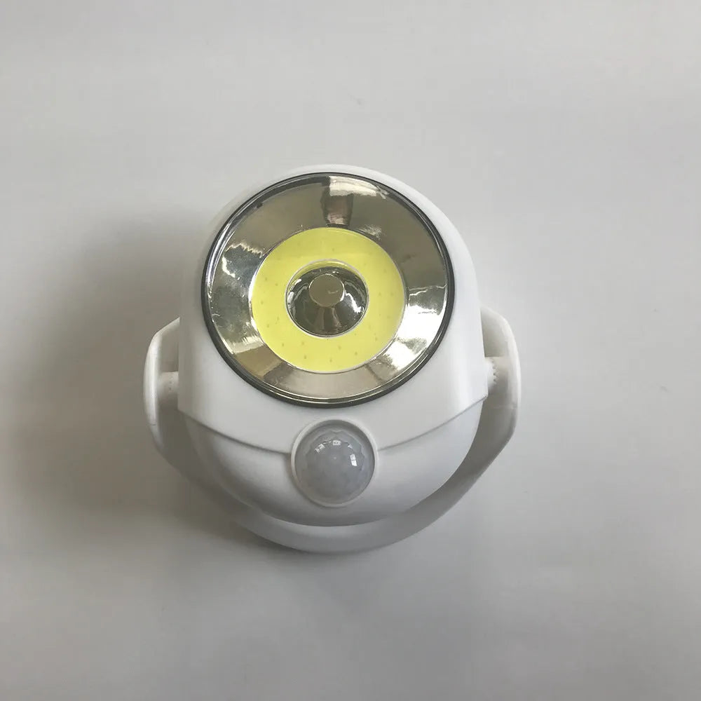 White Atomic Angel induction night light with ABS plastic housing and decorative angel design