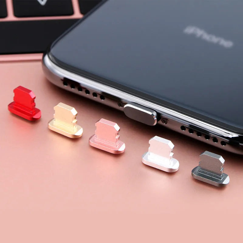 Aluminium alloy charging port dust plug for iPhone in various colours including gold, silver, blue, and black.