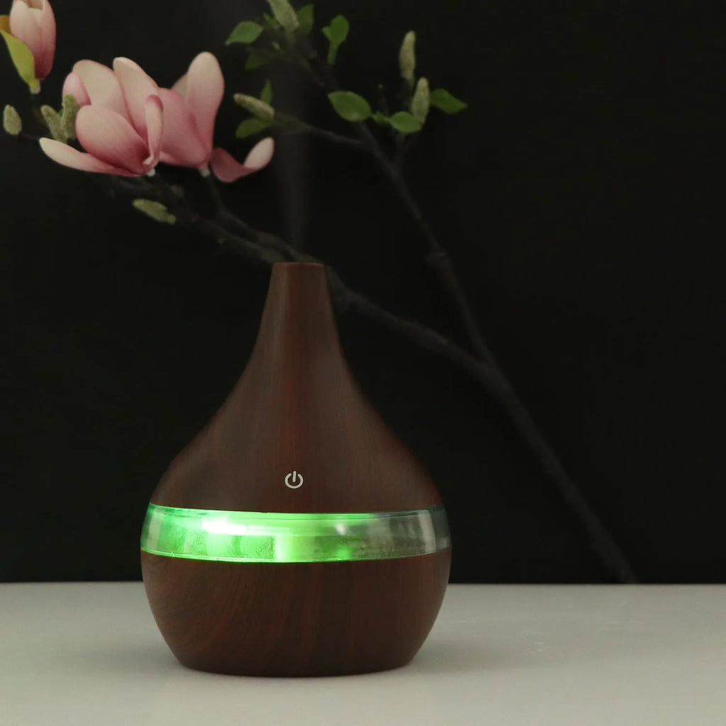 USB mini tip air purifier humidifier in wood grain, columnar shape, less than 1L tank, one fog outlet, 2-8 hour timer.