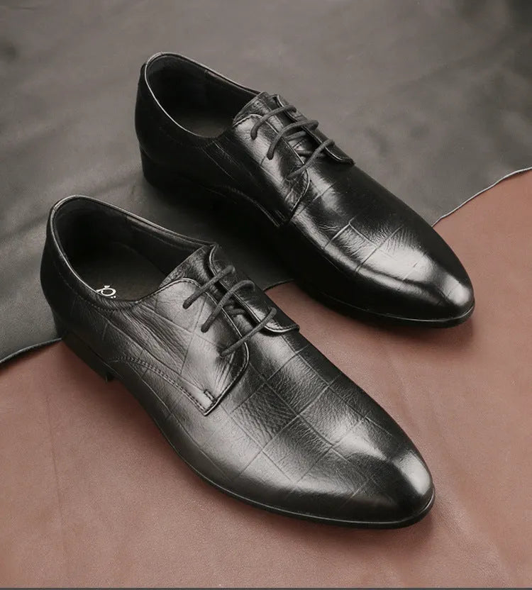 Men's black leather derby shoes with checkered pattern and pointed toe design on rubber soles