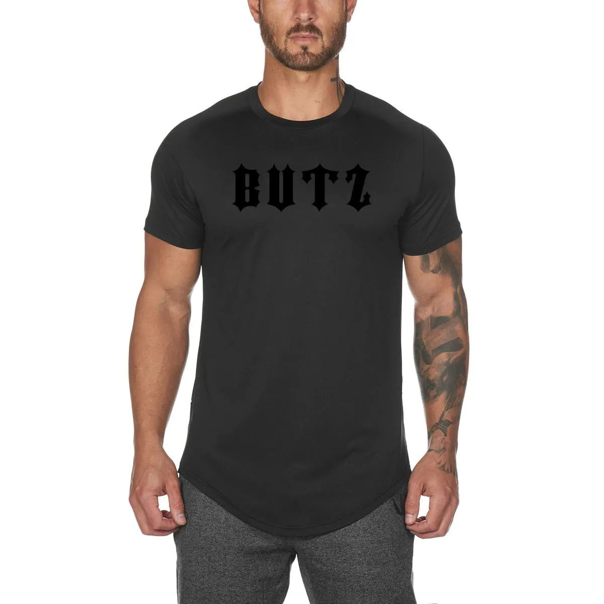Plain men's fitness shirt in army green, made from cotton and spandex blend, shown on a hanger.