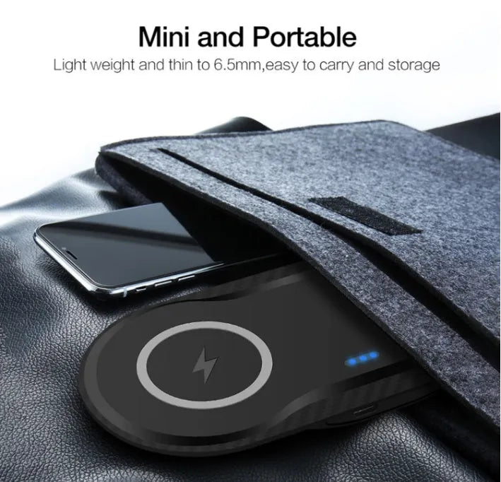 Black and white dual wireless charging pad charging two smartphones simultaneously