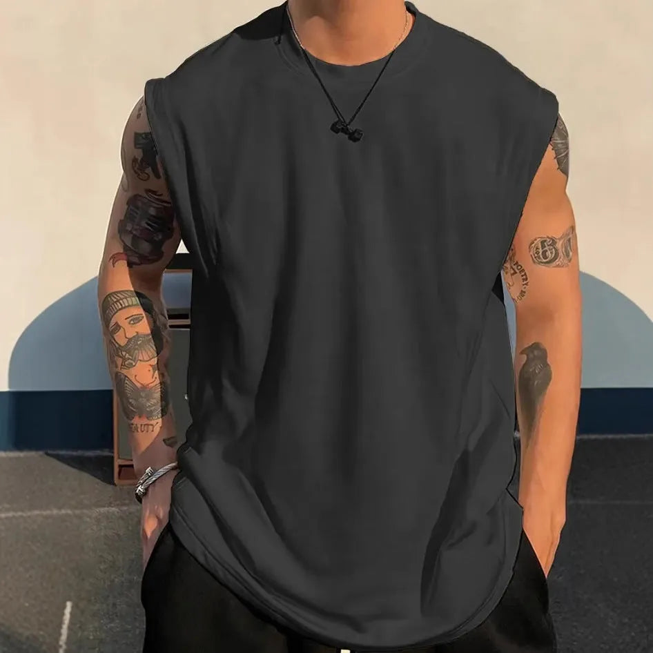 Men's loose solid colour cotton tank top on a hanger, showing straight hem and sleeveless design.
