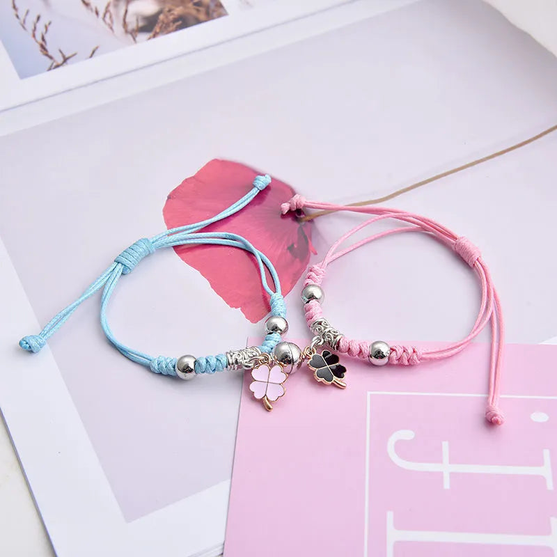 Magnet suction couple bracelets with alloy construction and various pendant designs including crowns and hearts