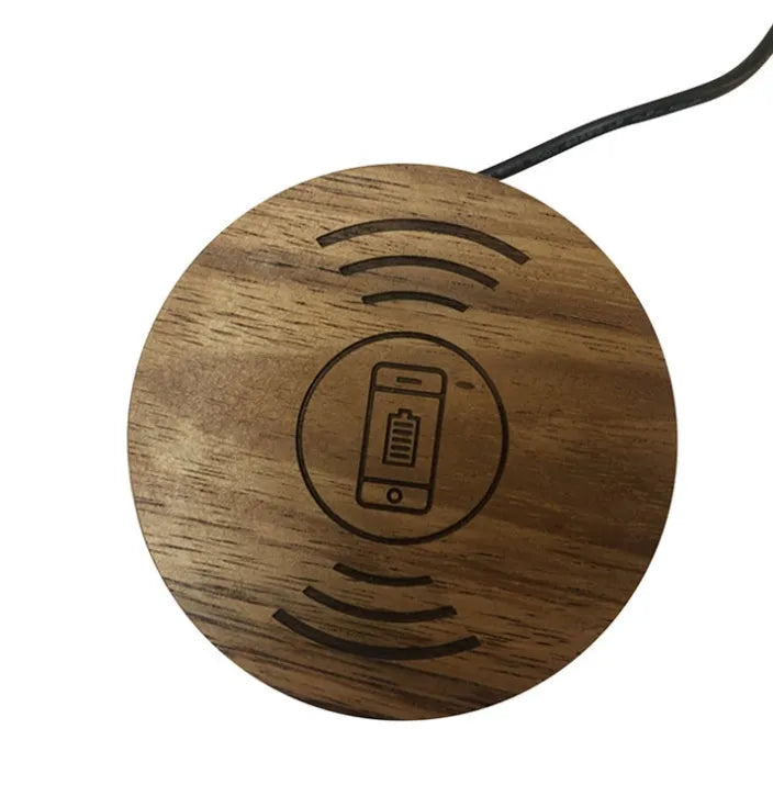Black 60mm round wireless phone charging pad for furniture installation