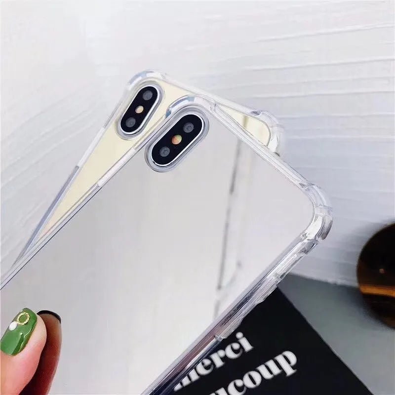 Black mirror-finish TPU protective case on an iPhone, showing soft edges and full screen coverage.
