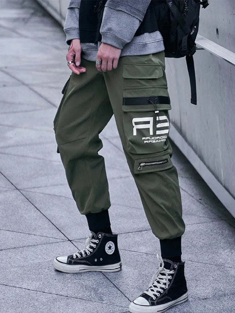Men's 100% polyester cargo trousers in Army Green with side pockets and drawstring waist