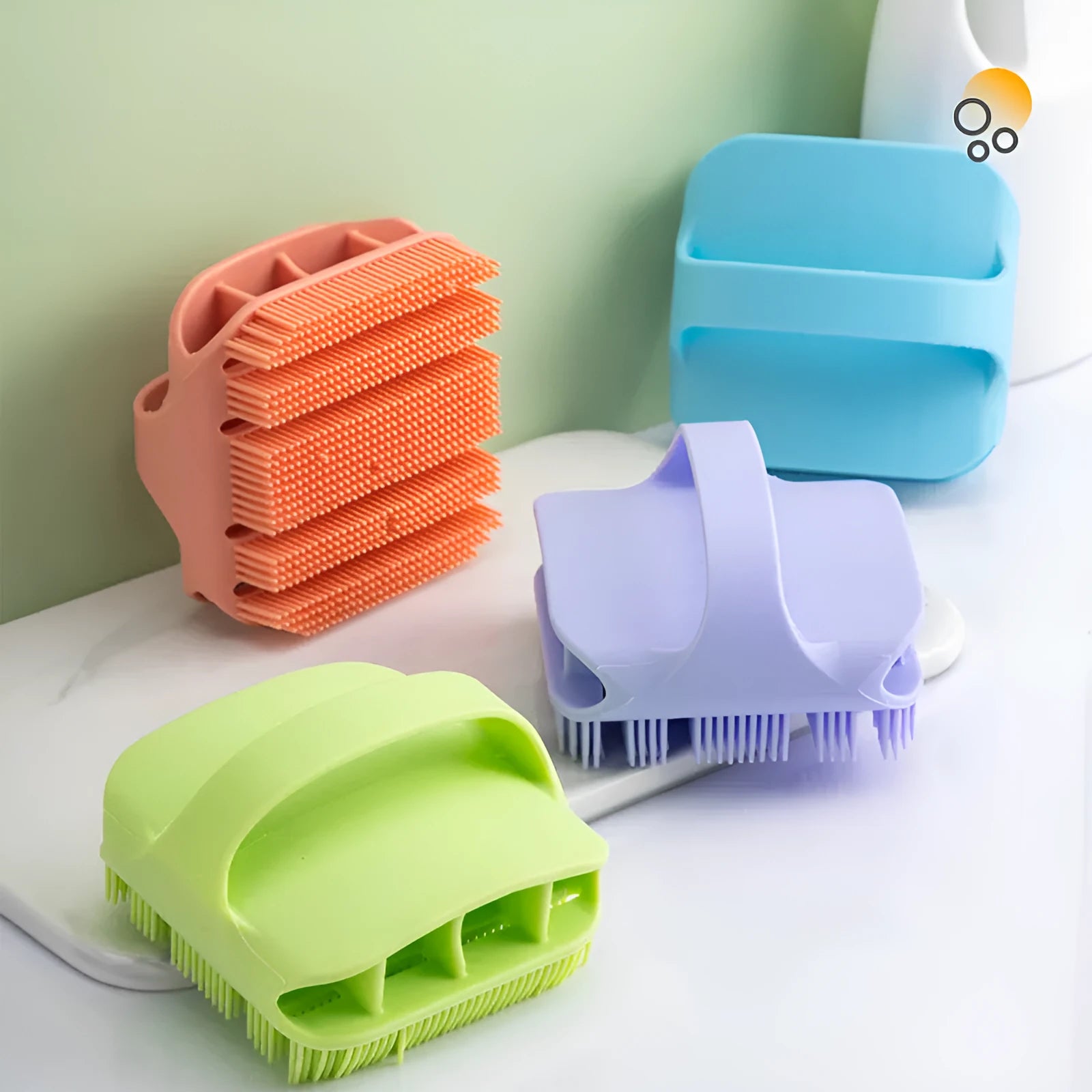 Blue silicone scalp massager brush with hand-strap handle for washing and massaging hair.