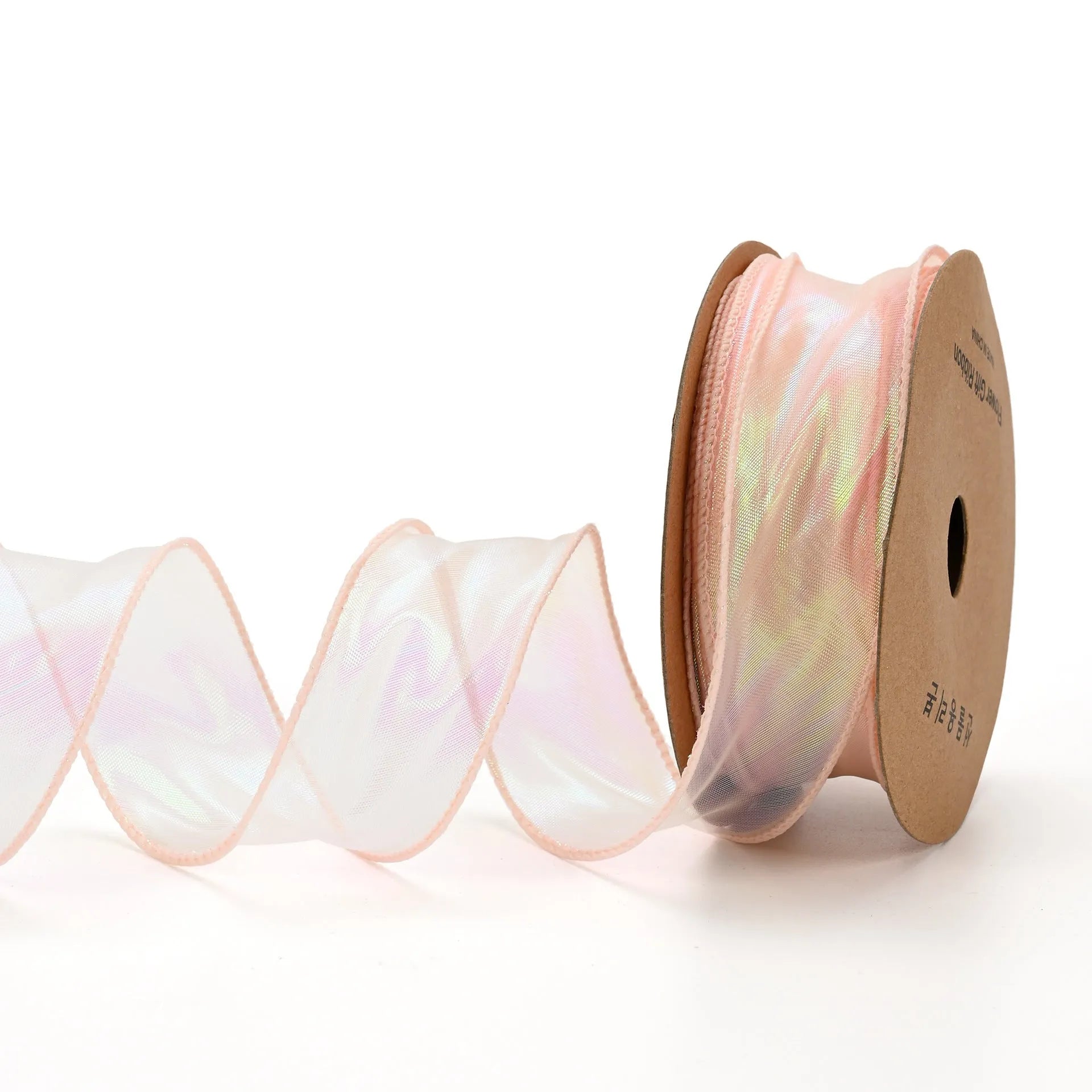 Roll of 4cm wide colourful mesh ribbon with fishtail yarn floral wave design.