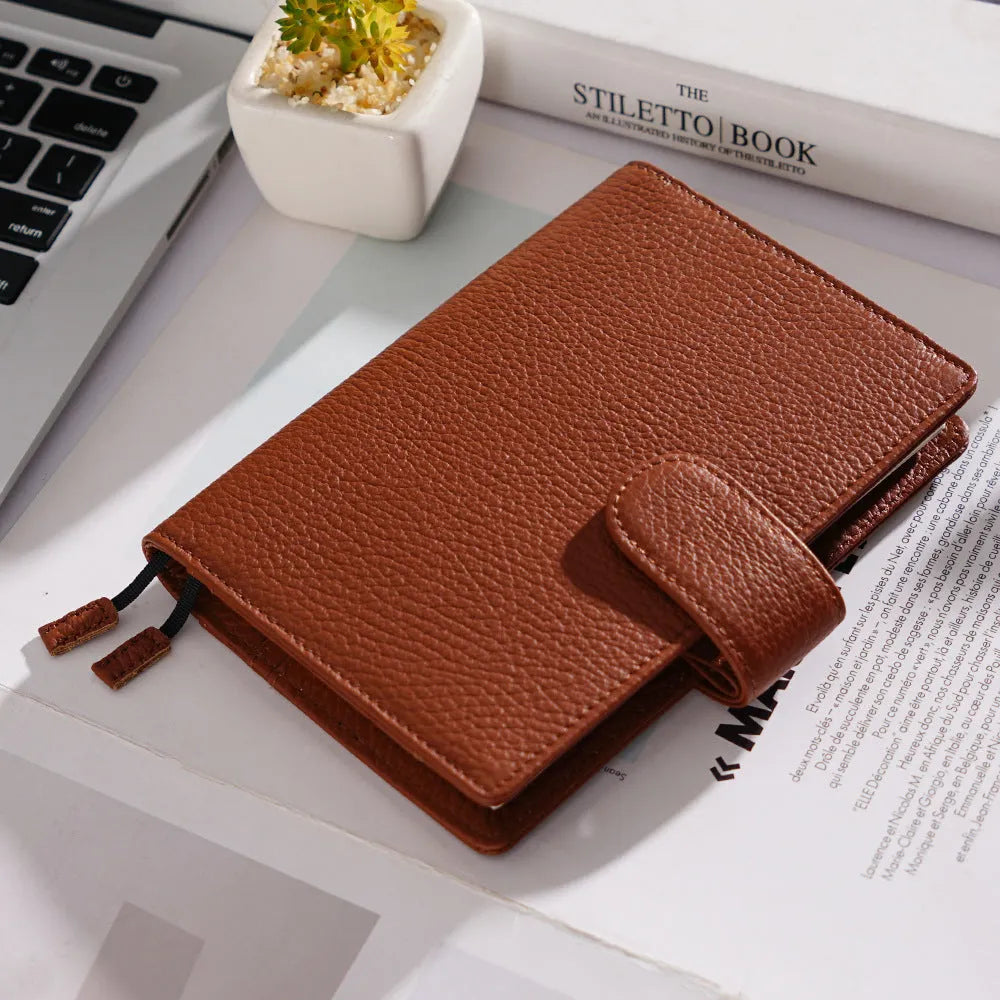 A6 loose-leaf diary with cowhide leather cover showing lychee pattern texture