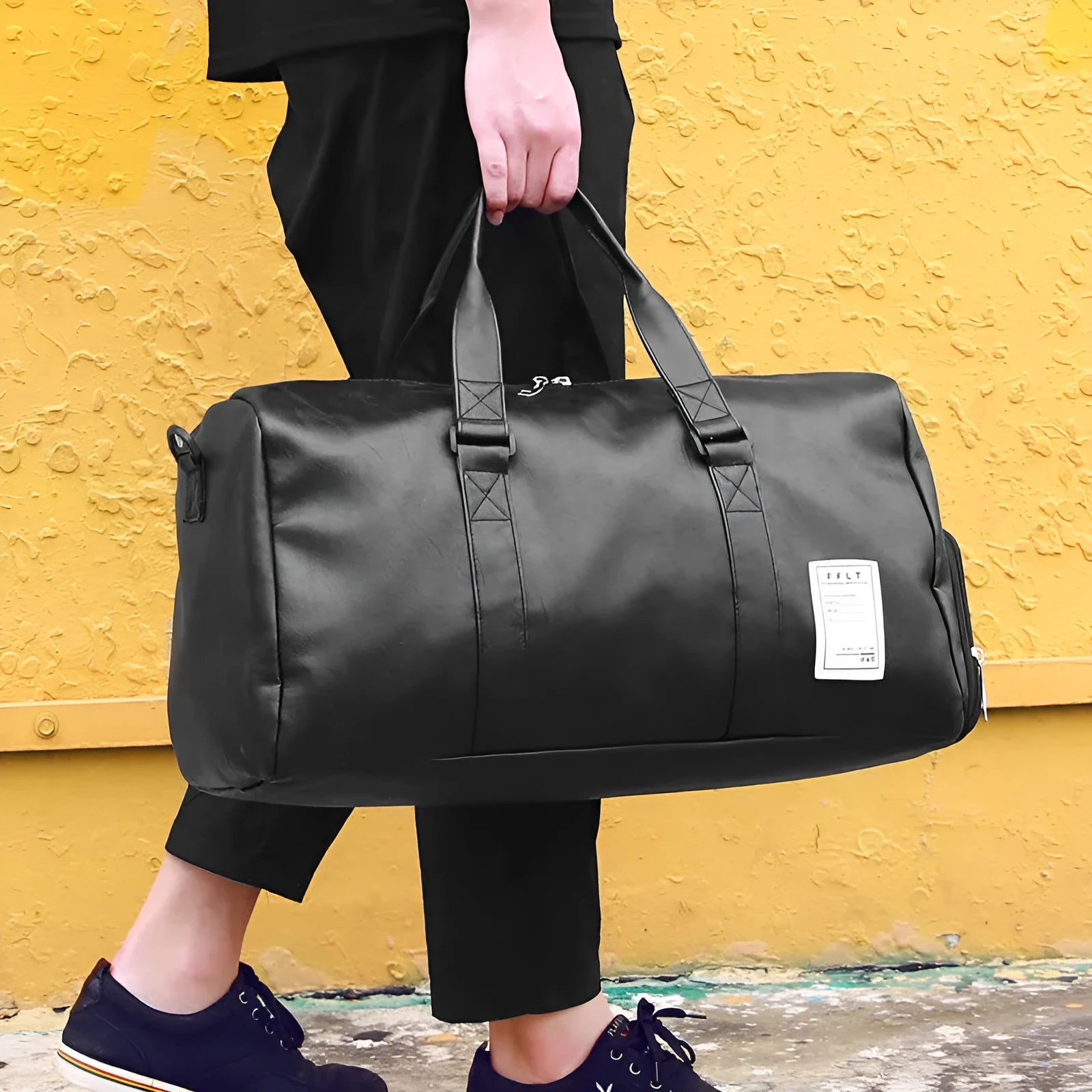Black waterproof sports duffle bag with a separate side shoe compartment and diagonal shoulder straps.