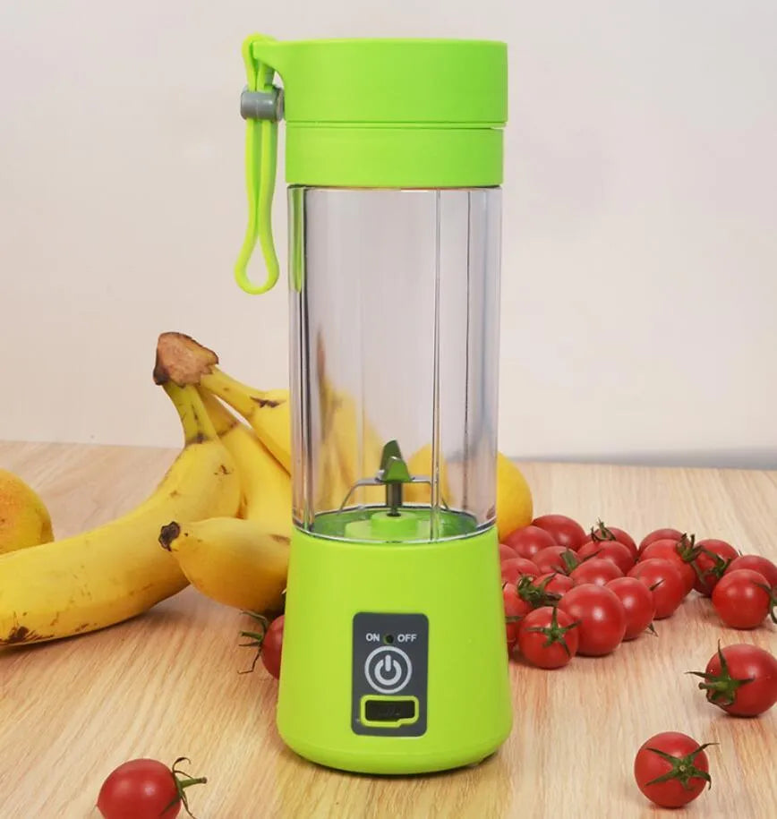 Mini USB-powered centrifugal fruit juicer in pink, with a 400ml plastic cup and stainless steel blade.