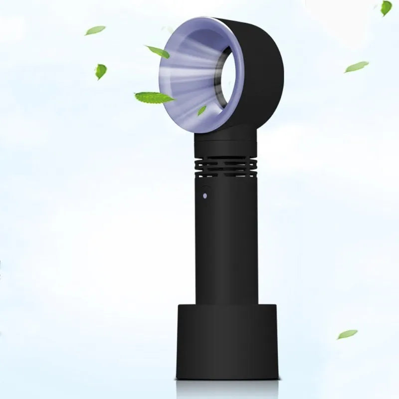 Compact portable bladeless desk fan with USB charging cable on a wooden desk