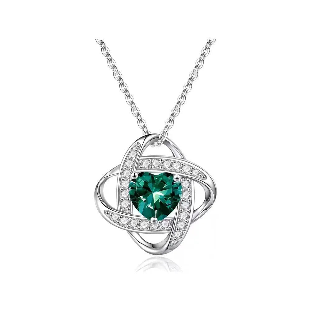 Women's electroplated copper heart-shaped necklace on a model, showing the red diamond colour variant.
