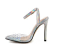 Women's pointed-toe sandals with glossy PVC upper and a thin stiletto heel on a neutral background.