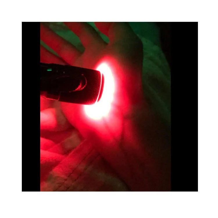 Black aluminium alloy smart vein locator with red LED lights on.