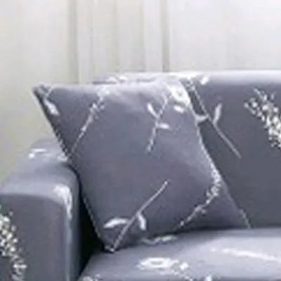 Geometric patterned stretch sofa slipcover fitted on a three-seater sofa