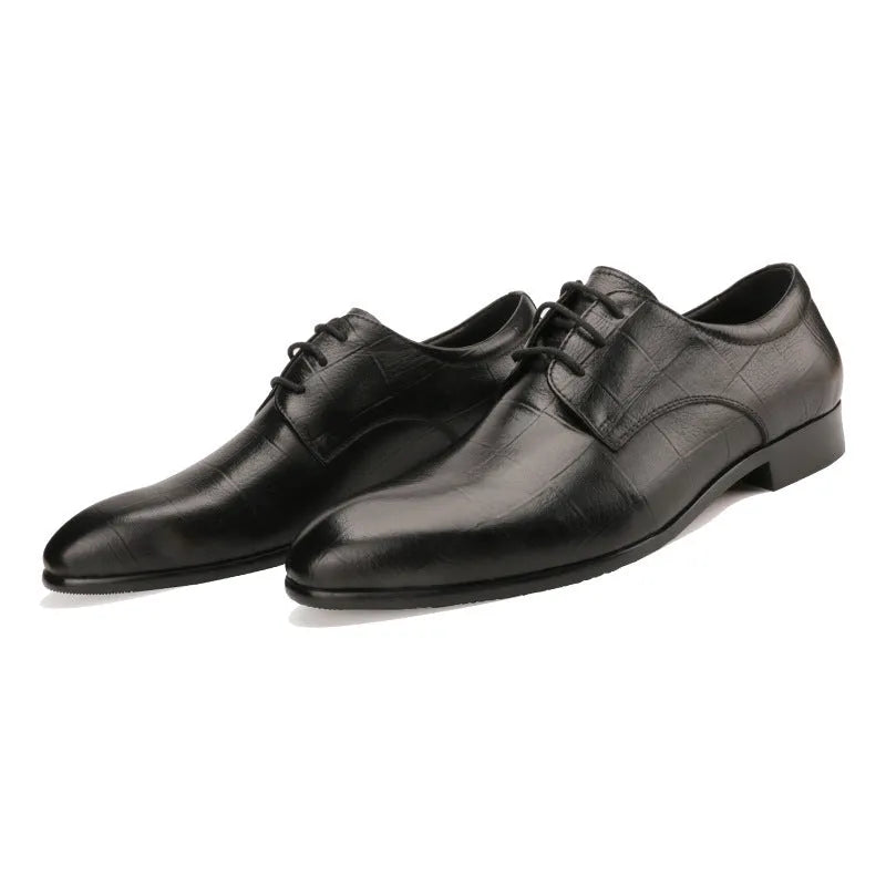 Men's black leather derby shoes with checkered pattern and pointed toe design on rubber soles