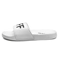 Men's black and white open toe slippers with a rubber sole, shown in large sizes.