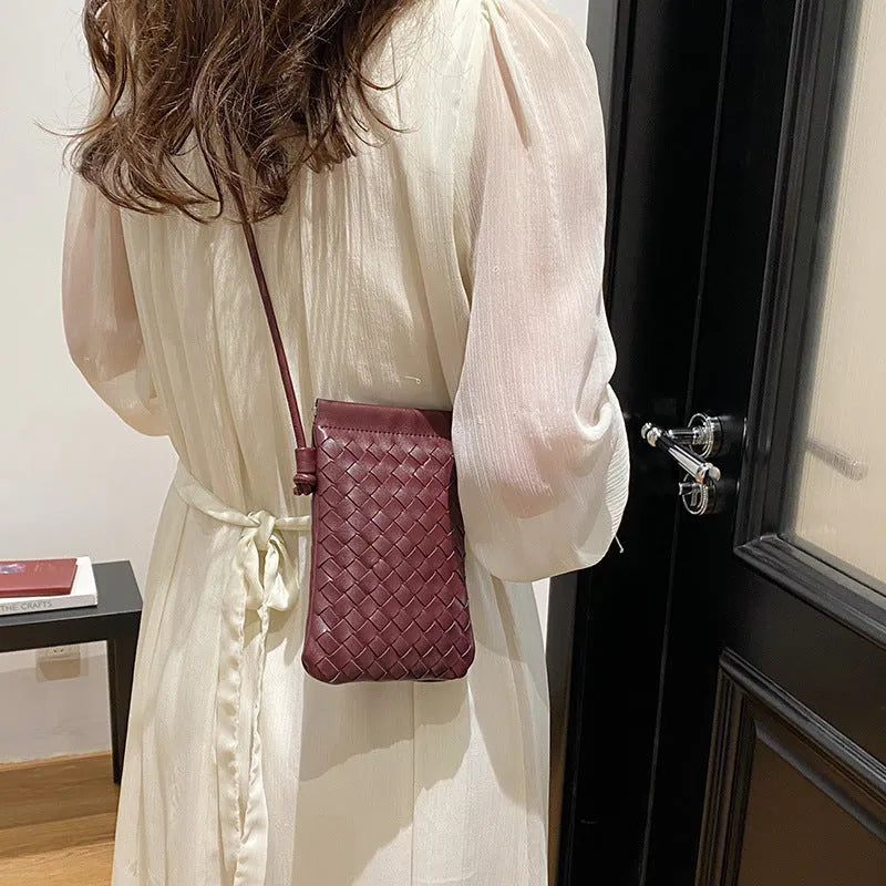 Vintage weave crossbody bag in vertical square shape showing European retro styling and dark cell internal compartment