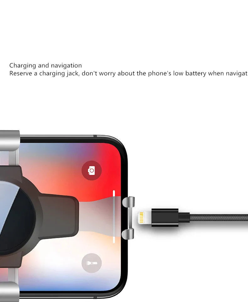 Black ABS gravity phone holder mounted on a car air vent with a mobile phone secured.