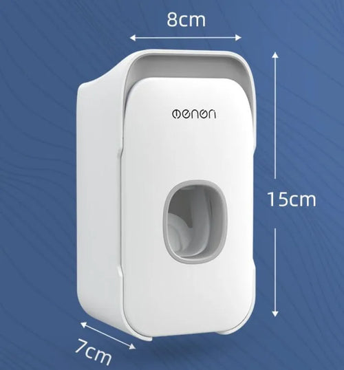 Blue automatic toothpaste dispenser made of ABS plastic mounted on a bathroom wall.