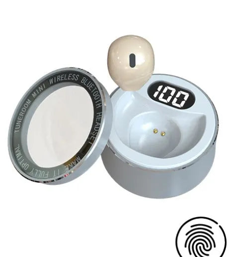 Close-up of a tiny skin-toned 9mm Bluetooth earpiece designed to be invisible in the ear.