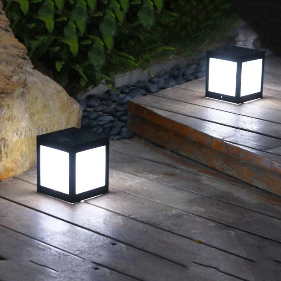 Solar-powered LED garden light in a UK garden setting, showing waterproof design and light emission.