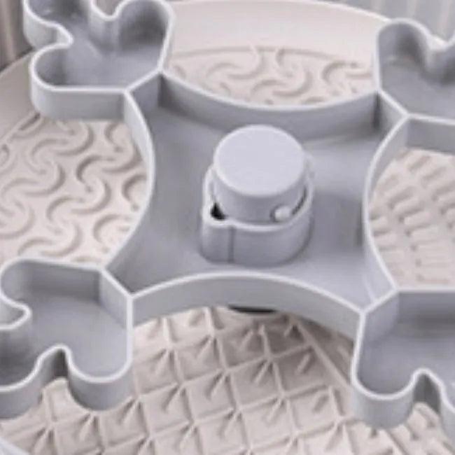 Colourful rotating pet slow feeder bowl with a silicone licking mat in a windmill design.
