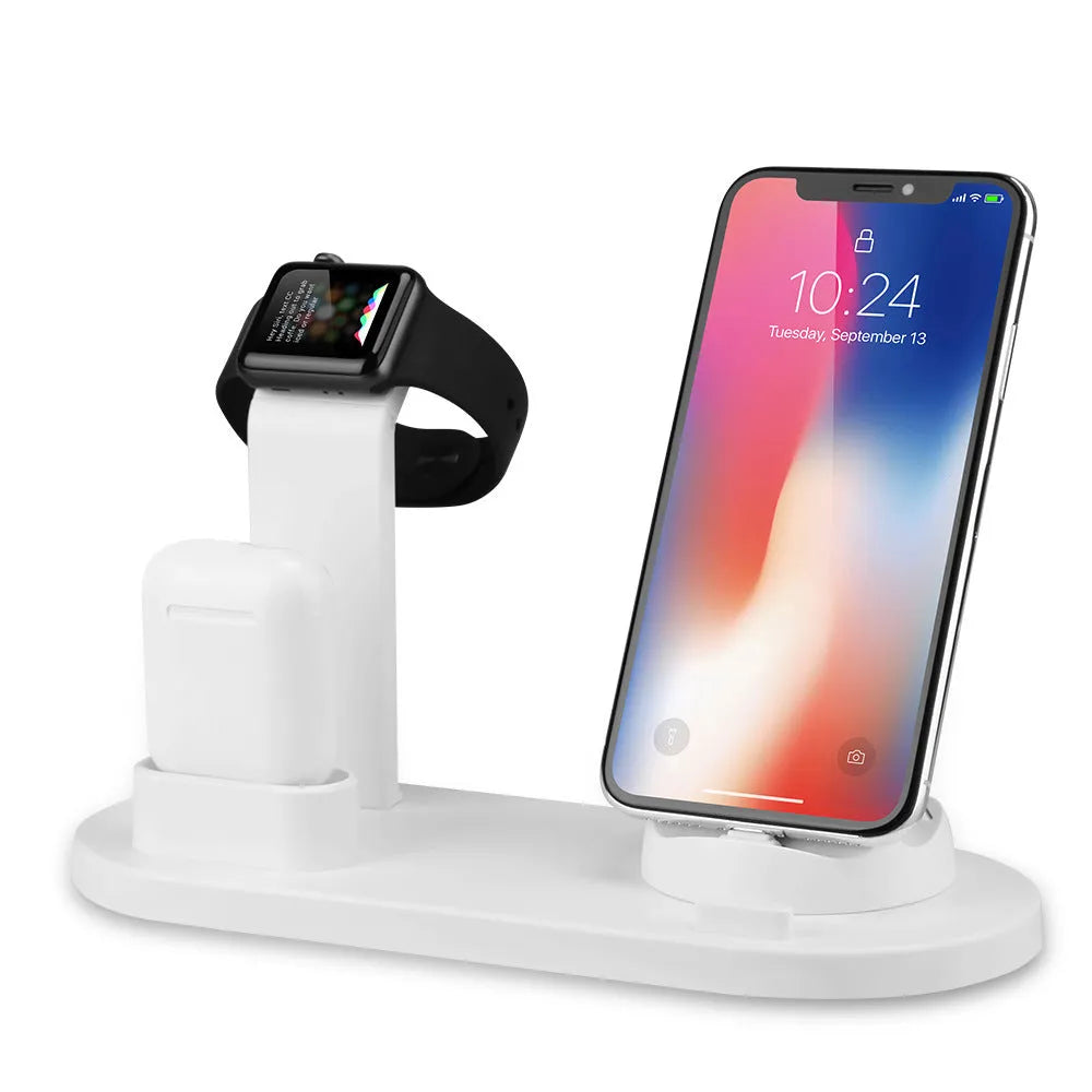 White or black plastic headphone charging stand with a USB port for phones.