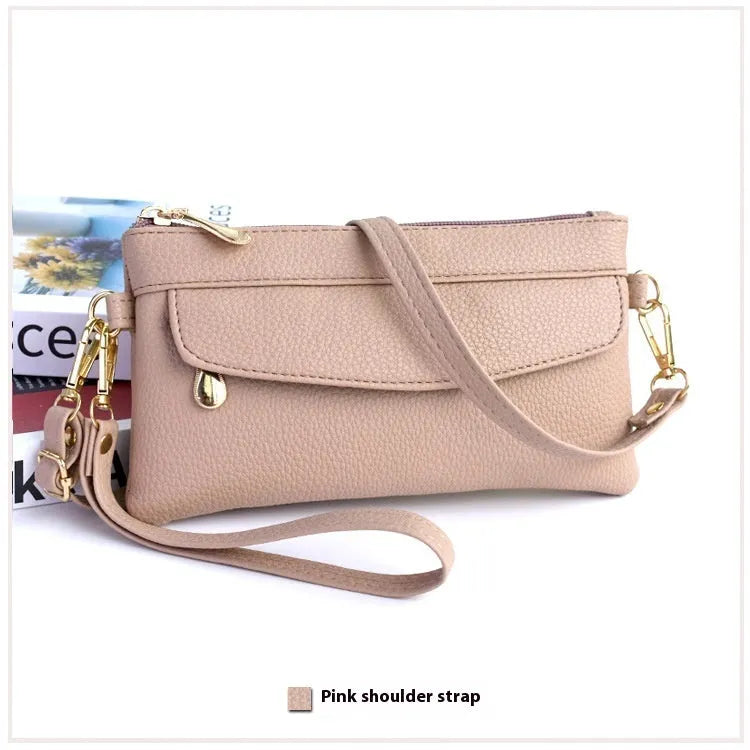 Soft PU leather crossbody bag in a square shape showing the internal sandwich zipper pocket.