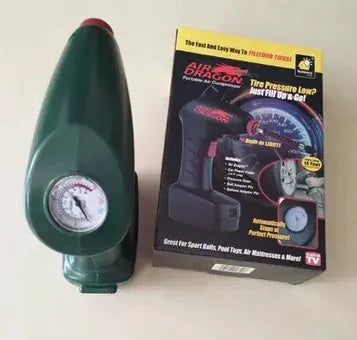 Black portable car tyre inflator with digital display and LED light on a coiled power cable.