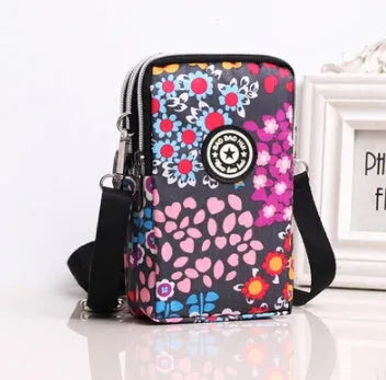 Vertical mobile phone bag in black with Oxford Spinning texture and zipper closure