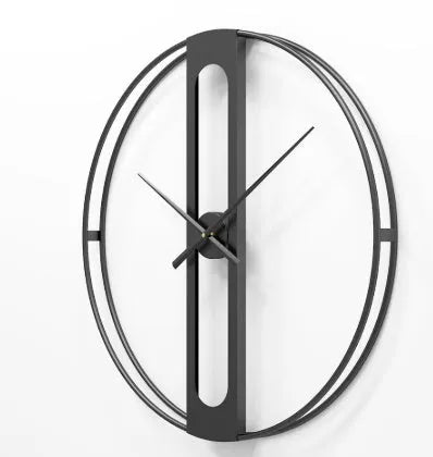 Large round metal wall clock with Roman numerals on a white wall.