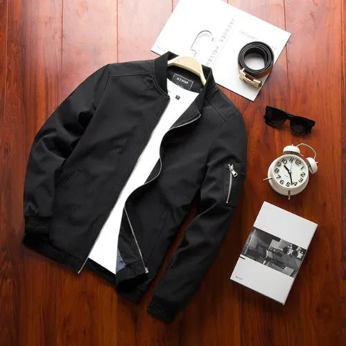 Men's slim-fit casual baseball jacket with zippered side pockets in a solid colour.