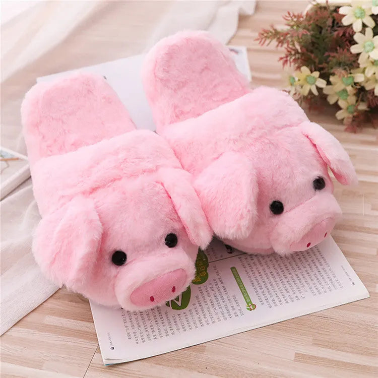 Pink pig-shaped plush floor slippers for indoor use.
