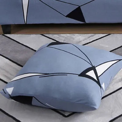 Geometric patterned stretch sofa slipcover fitted on a three-seater sofa
