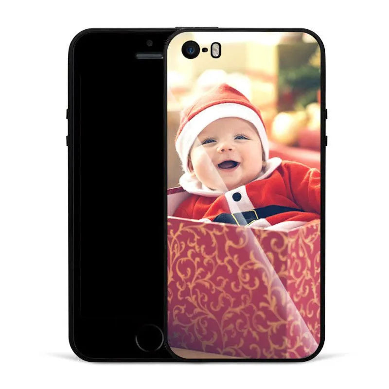 Patterned ultra-thin iPhone case with raised camera bumper edge on a table.