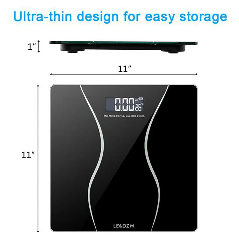 Black electronic digital body scale on a floor, showing a weight readout.