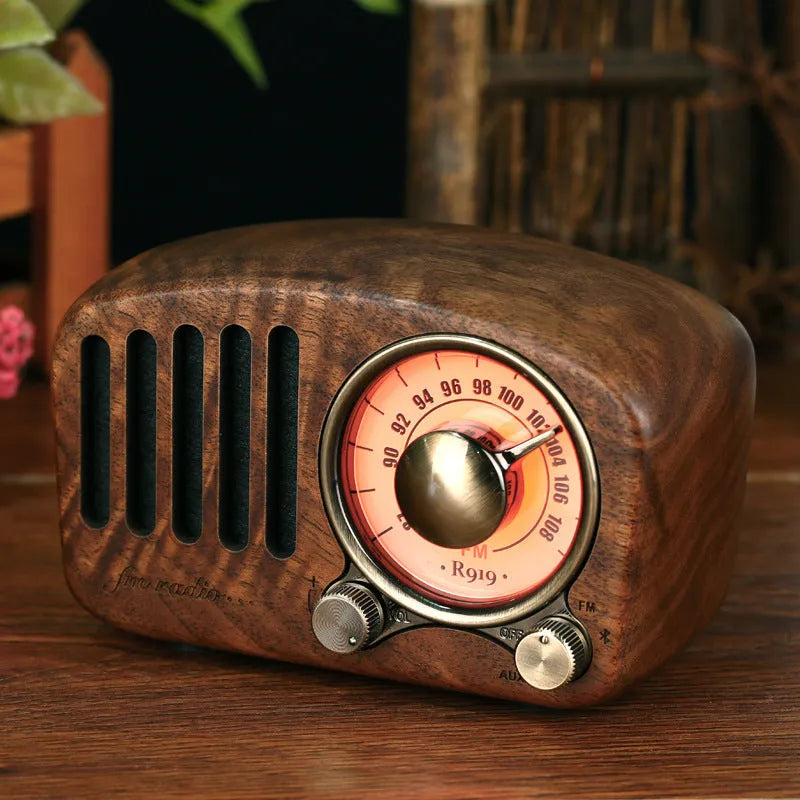 Retro wooden mini Bluetooth speaker in walnut finish showing front grille and side USB port