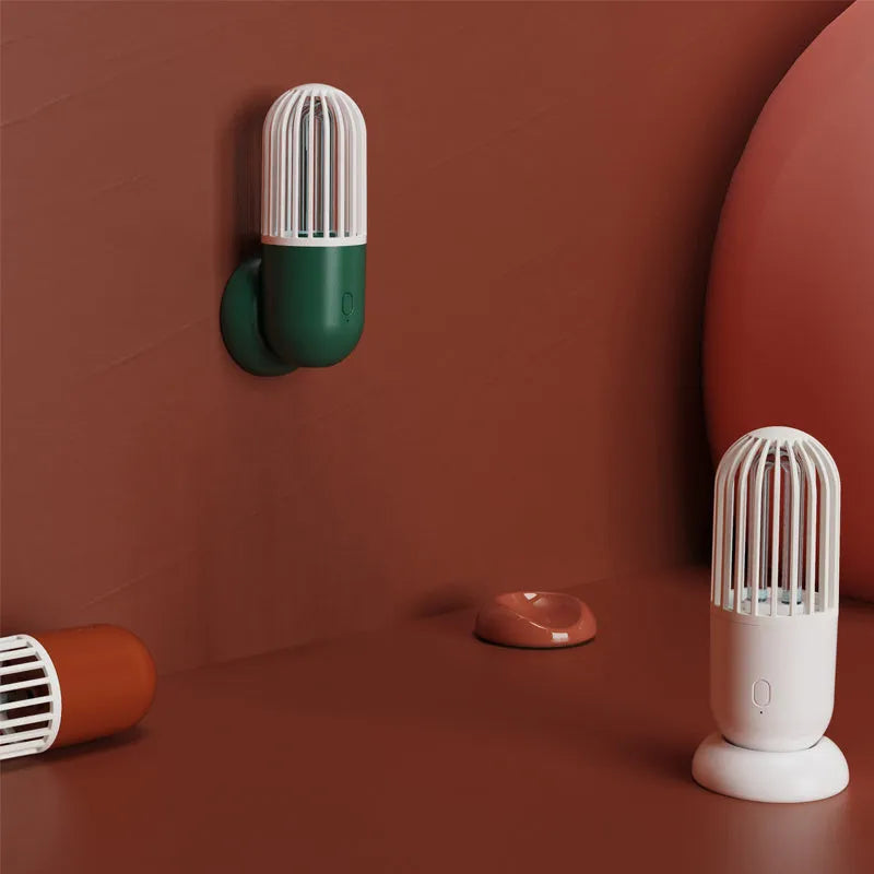 Portable capsule UVC disinfection lamp in four colours with dimensions 64x64x148mm