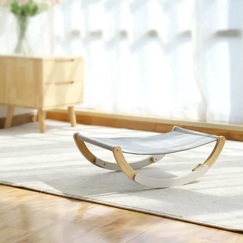 Solid wood cat shaker pet nest with off-ground design, anti-slip mat, and grey or blue cloth cushion, 56.5x30cm