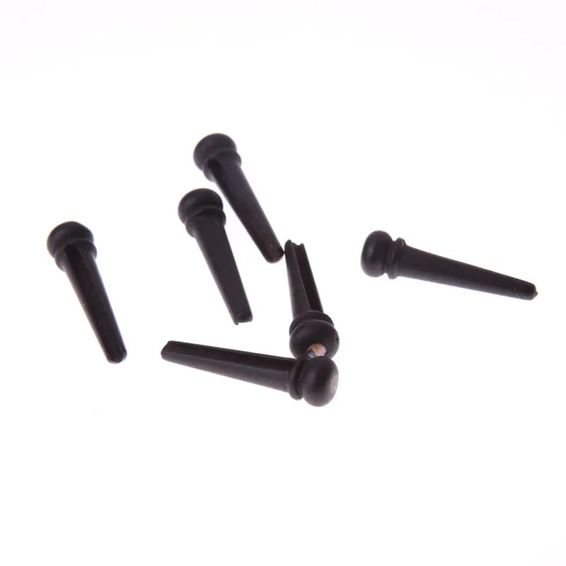 Six ebony folk guitar string nails with 5.3mm bayonet diameter in matt black finish