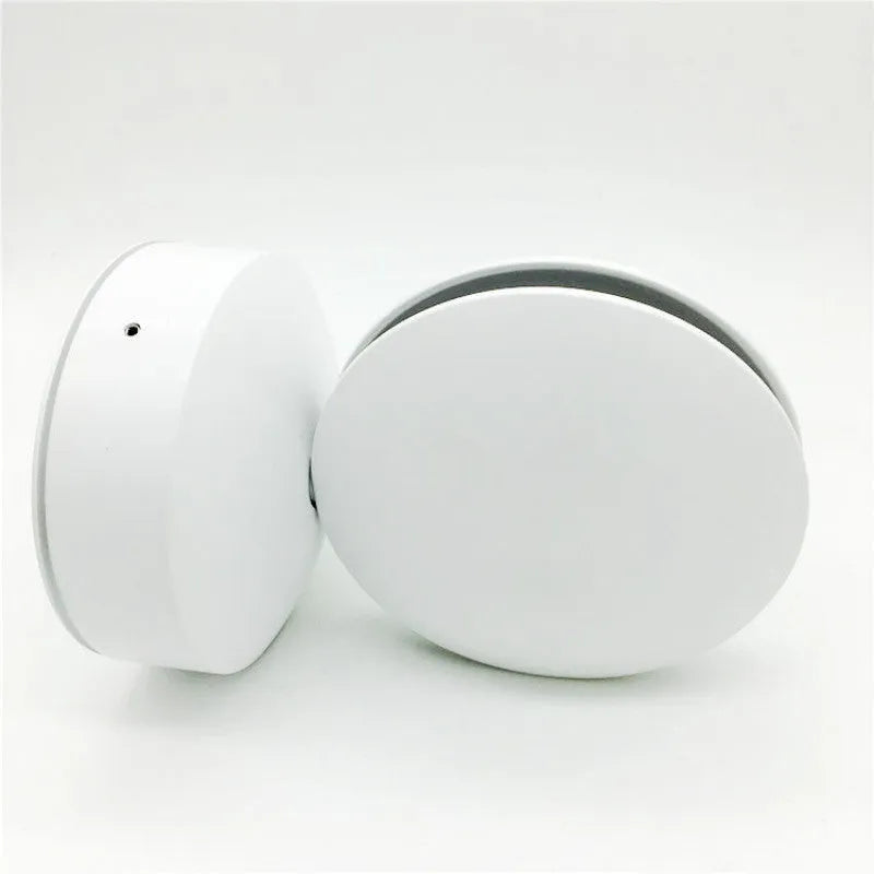 Modern aluminium spotlight bar wall lamp with glass lens, mounted on a wall.