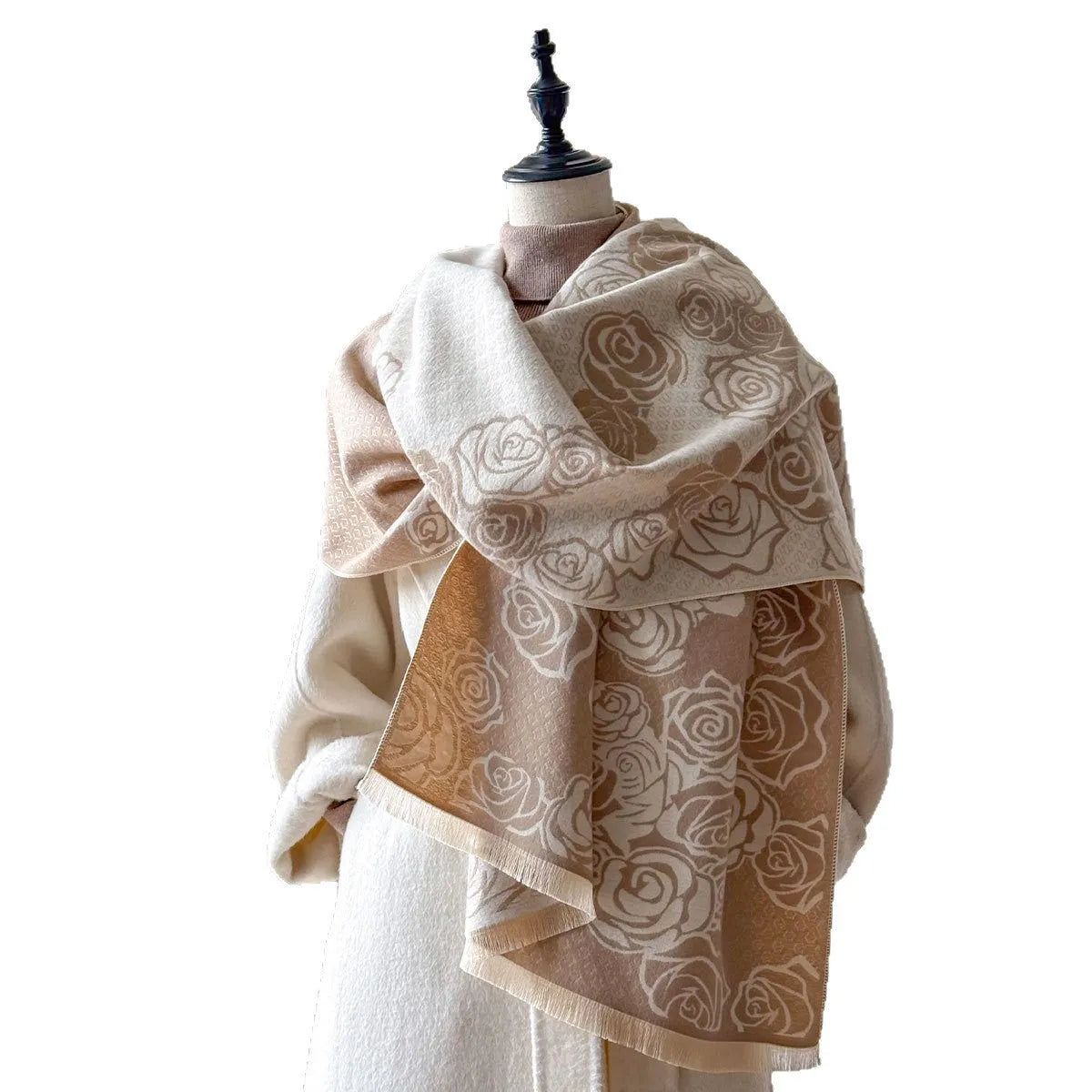 Long grey imitation cashmere winter scarf with tassel fringe on a neutral background.