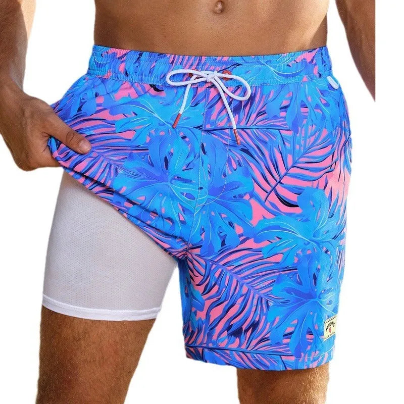Man wearing loose green boxer-style swimming trunks made from quick-drying spandex fabric.