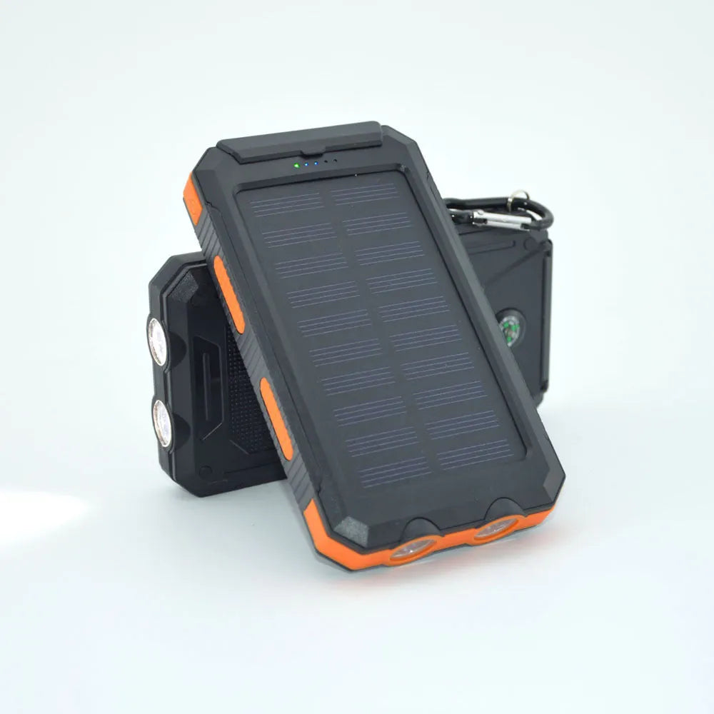 Solar power bank with dual LED headlights and compass display, shown in black colour.