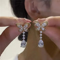 Platinum colour bow stud earrings with electroplated finish on zinc alloy