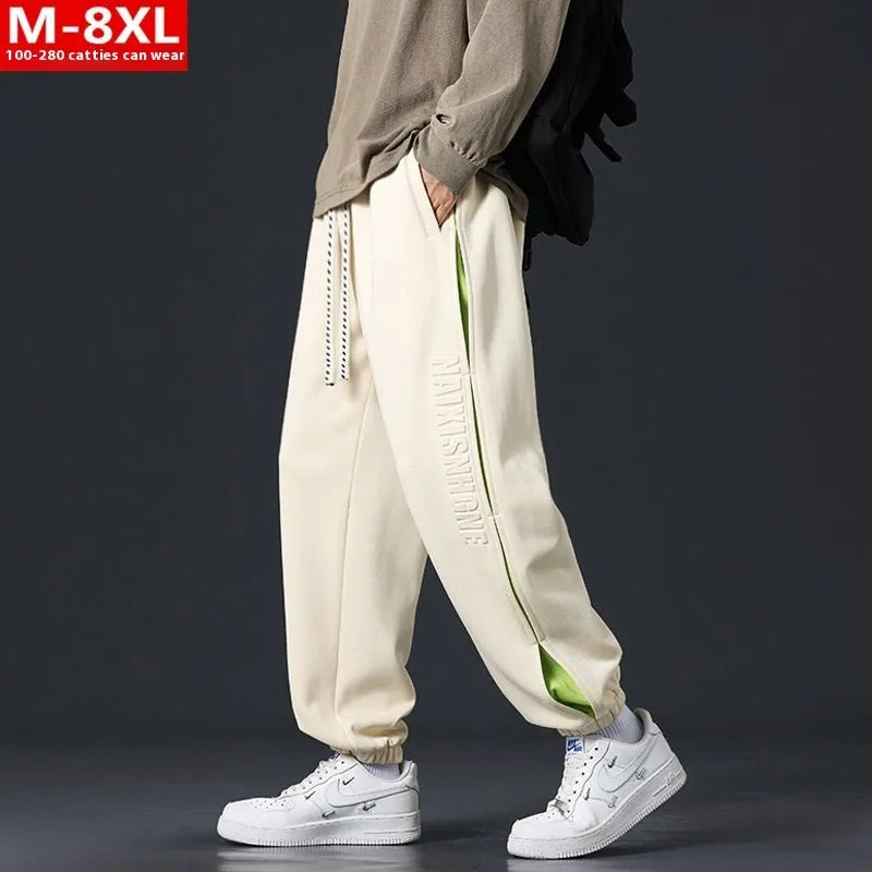 Men's loose cotton trousers with stitching detailing and ankle banding in grey green colour