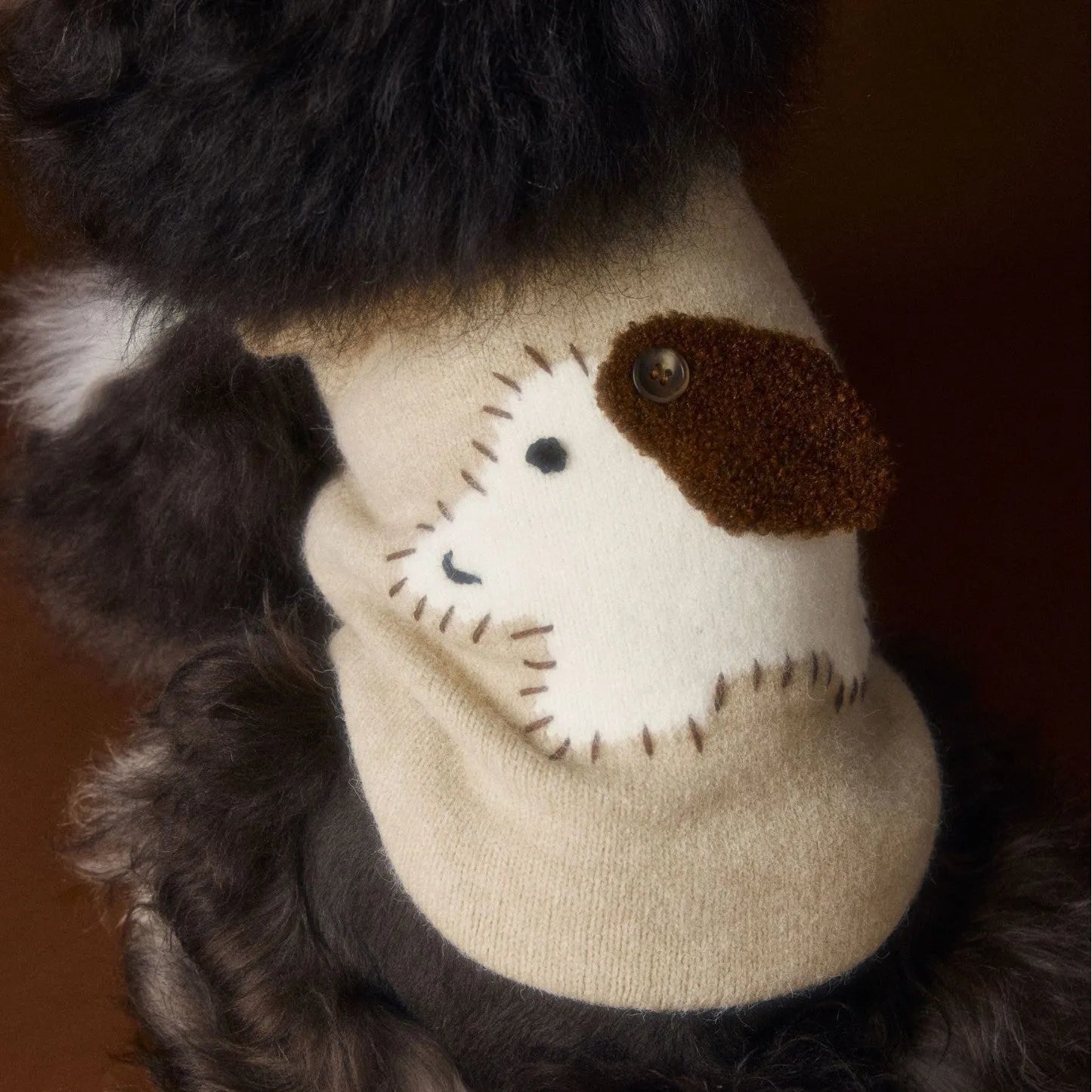 Wool sleeveless dog sweater vest in beige with ear cutouts for small breeds on a white background